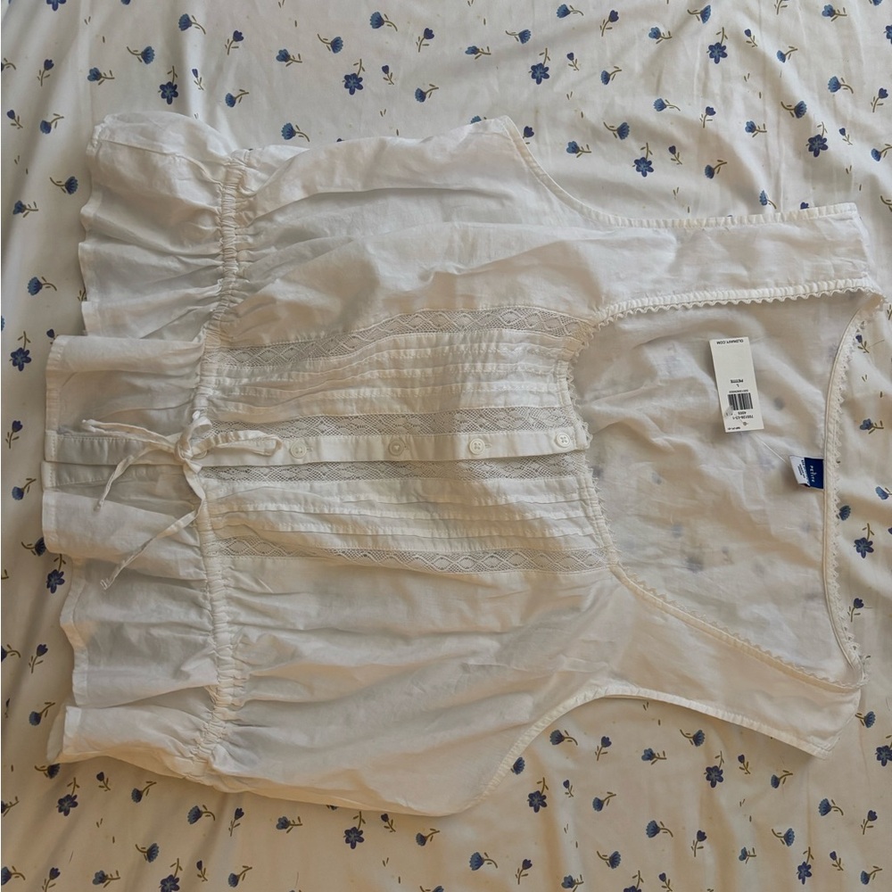 White Sleeveless Blouse with Lace Details
